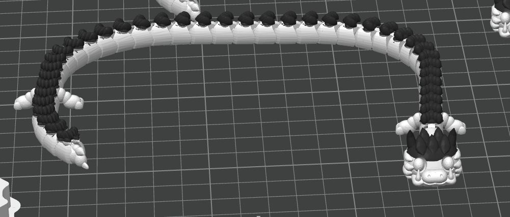 Dragon V2 design preview, white articulated dragon with contrasting dark tufts and a smiling face